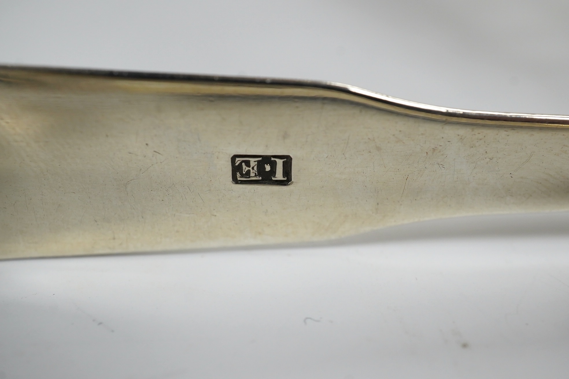 Two pairs of 19th century silver sugar tongs, including London, 1803 and a silver bonbon dish. Condition - fair to good